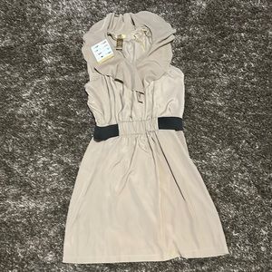 I’m selling a brand new tan Miss Tina Knowles casual ruffle dress.